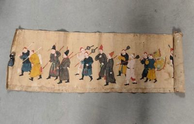 a long piece of cloth with a picture of a group of people