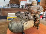 a small metal statue of a man on a motorcycle