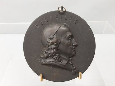 a picture of a plaque of a man with long hair