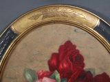 a picture of a painting of roses in a gold frame