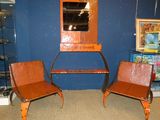 two chairs that are sitting in front of a mirror