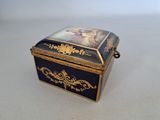 a blue and gold box with a picture on it