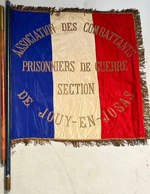 a french flag hanging on the wall next to a pencil