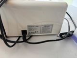 a white toaster sitting on top of a counter
