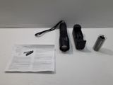 a pair of black shoes and a can of soda on a table
