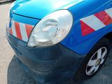 a small blue car with red and white stripes on it