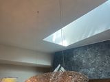 a light that is hanging from the ceiling in a room