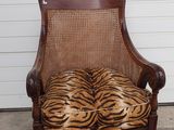 zebra print upholstered chair in front of a garage door