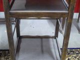 a wooden table with two shelves on top of it