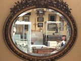 a mirror hanging on a wall in a room