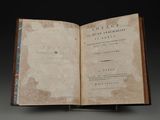 an old book opened to a page with writing on it