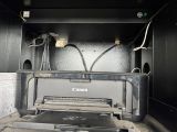 an image of a canon printer in the back of a truck