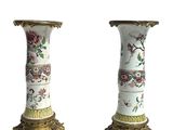 pair of antique chinese vases with floral designs on them