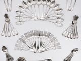 a lot of silver spoons and spoon spoons on a table