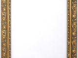 a gold picture frame with a white background
