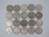 several different types of chinese coins on a white surface