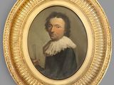 portrait of a man in a black coat holding a brush and a comb