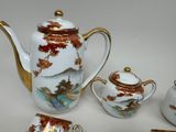 four pieces of tea and coffee set on the table