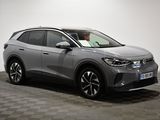 a grey toyota c - hr suv parked on a checkered floor
