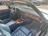 a picture of the interior of a car that is parked in a parking lot
