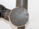 a close up of a metal pipe with a hole in it