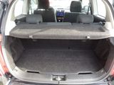 the back of a car with its trunk open and the seats folded down