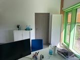 a desk with a computer and a monitor on it
