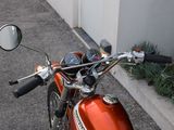 a red motorcycle parked on the side of the road