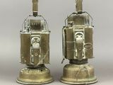 two metal robots that are sitting on top of each other