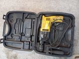 a tool in the case that is open on the floor