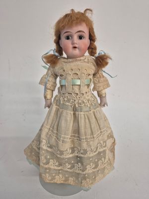 a small doll that is sitting on a table