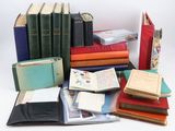 a lot of books that are stacked on top of each other
