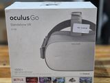the box for the oculuss go headset is on a wooden table