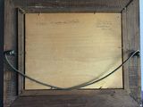 an old photo of a wooden frame with a rope hanging from it