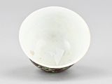 an image of a white bowl with a green design on it