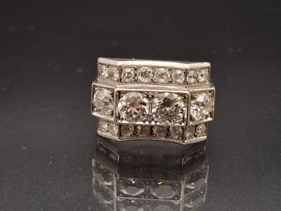 an image of a diamond ring on a black surface
