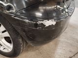 a close up of a car with a denting on it