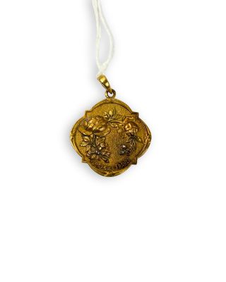 an image of a gold medal on a white string