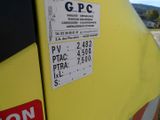a close up of a sign on the side of a yellow truck