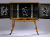 a cabinet that has a glass door on top of it