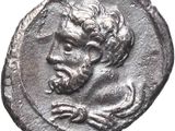 a silver coin with a head of a man on it