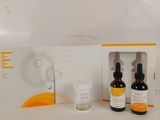 some of the products are sitting on the counter in front of the box