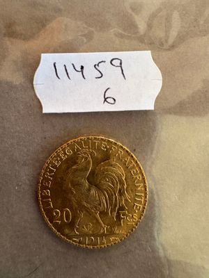 une image représentant une pièce d'or sur laquelle est posé un petit bout de papier