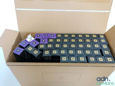 a box full of purple and black batteries in it