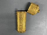 pair of gold plated lighters with a design of flowers and birds