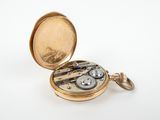 an image of a pocket watch with a chain attached to it
