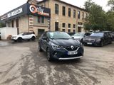 the car is parked in front of the building in the parking lot