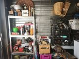 a room with a lot of stuff on the shelves