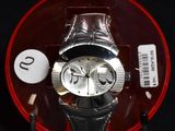 a watch that is sitting on top of a red plate