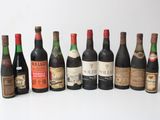 several bottles of wine are lined up in a row on a table